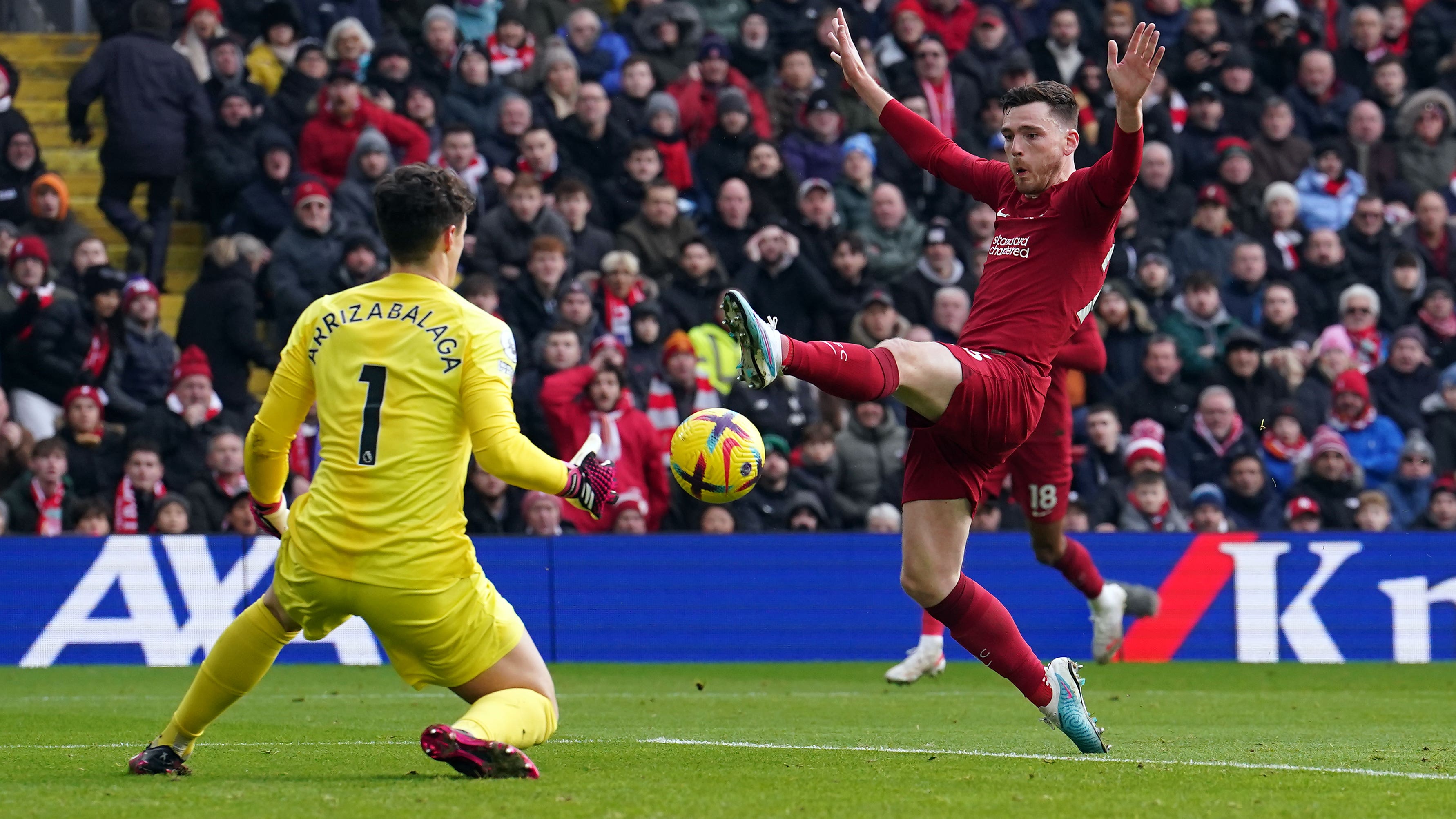 Chelsea goalkeeper Kepa Arrizabalaga saves at the feet of Liverpool’s Andrew Robertson (Martin Rickett/PA)