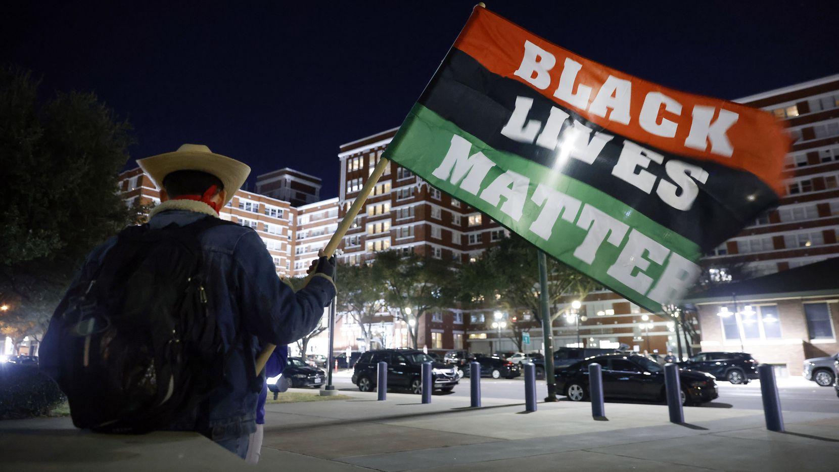 With his flag in hand, Joey Steele of Sherman joined activists, including the Next...