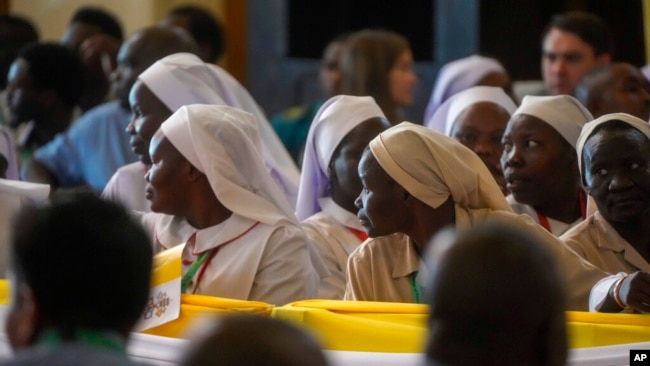 Nuns wait for the arrival of Pope Francis for a meeting with priests, deacons, consecrated people and seminarians at the Cathedral of Saint Theresa in Juba, South Sudan, Feb. 4, 2023.