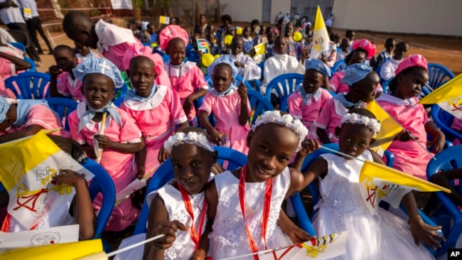 Young girls await the arrival of Pope Francis at the St. Theresa Cathedral in Juba, South Sudan, Feb. 4, 2023.