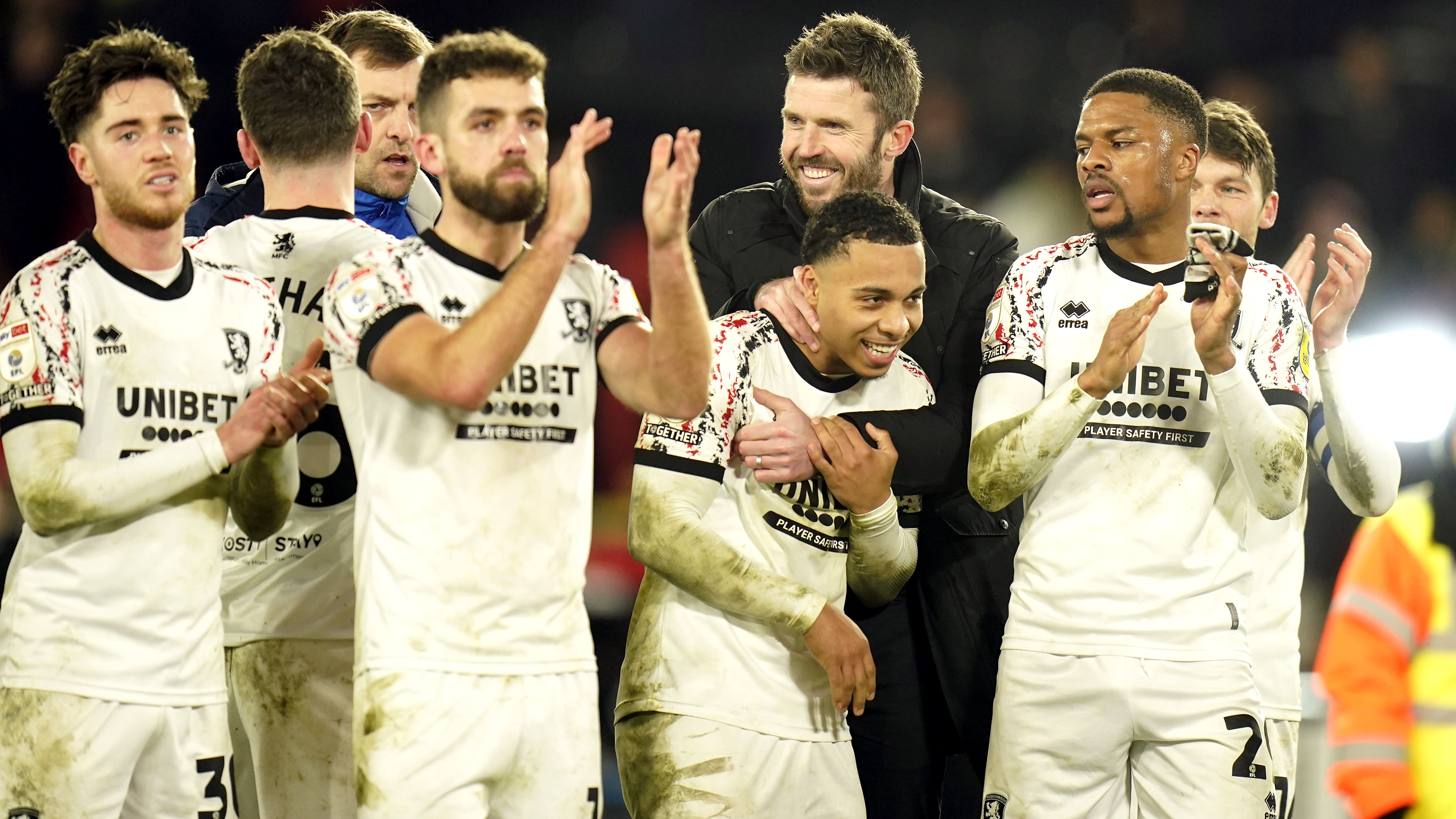 Michael Carrick (centre) and players celebrate their victory (Danny Lawson/PA)