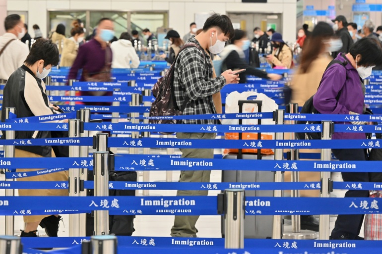 Travelers queue up at the Lok Ma Chau immigration checkpoint.