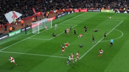 Arsenal players celebrate Reiss Nelson's late strike