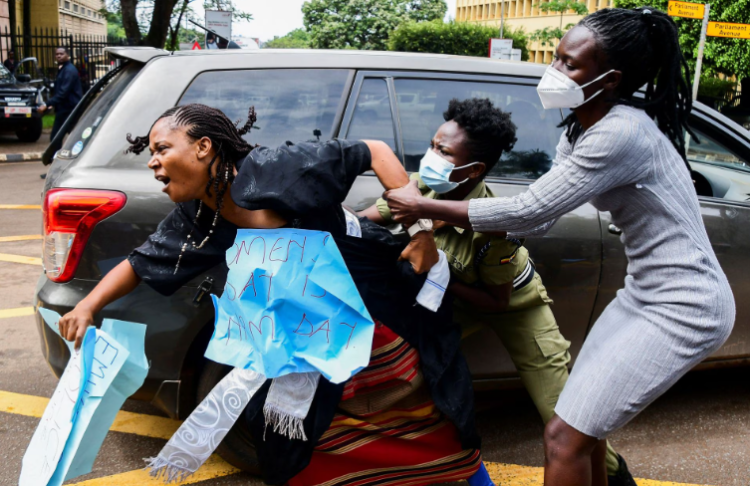 Ugandan riot police officers attempted to detain Masaka district Woman Member of Parliament Joan Namutaawe, as female opposition legislators participate in a protest