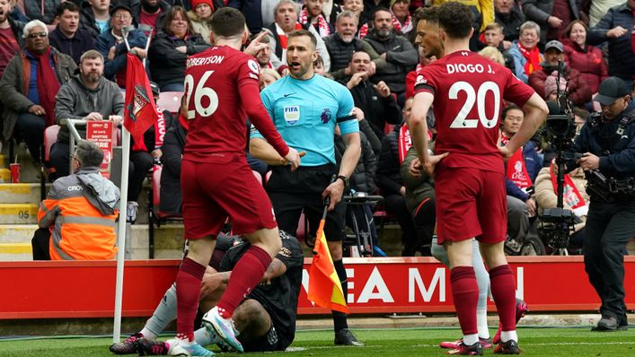 Andy Robertson and Constantine Hatzidakis have words during Liverpool's draw with Arsenal
