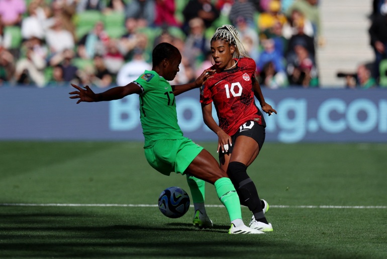 Soccer Football - FIFA Women’s World Cup Australia and New Zealand 2023 - Group B - Nigeria v Canada - Melbourne Rectangular Stadium, Melbourne, Australia - July 21, 2023 Nigeria's Francisca Ordega in action with Canada's Ashley Lawrence REUTERS/Asanka Brendon Ratnayake