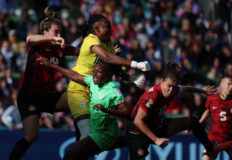 Soccer Football - FIFA Women’s World Cup Australia and New Zealand 2023 - Group B - Nigeria v Canada - Melbourne Rectangular Stadium, Melbourne, Australia - July 21, 2023 Nigeria's Chiamaka Nnadozie and Michelle Alozie in action with Canada's Adriana Leon and Christine Sinclair REUTERS/Asanka Brendon Ratnayake