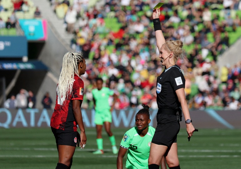 Soccer Football - FIFA Women’s World Cup Australia and New Zealand 2023 - Group B - Nigeria v Canada - Melbourne Rectangular Stadium, Melbourne, Australia - July 21, 2023 Canada's Ashley Lawrence is shown a yellow card by referee Lina Lehtovaara REUTERS/Asanka Brendon Ratnayake