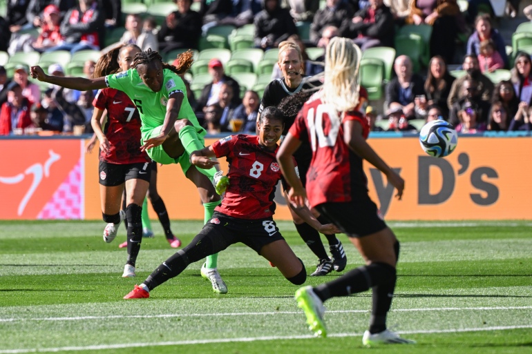 Nigeria's forward #06 Ifeoma Onumonu (L) shoots on goal during the Australia and New Zealand 2023 Women's World Cup Group B football match between Nigeria and Canada at Melbourne Rectangular Stadium, also known as AAMI Park, in Melbourne on July 21, 2023. (Photo by WILLIAM WEST / AFP)