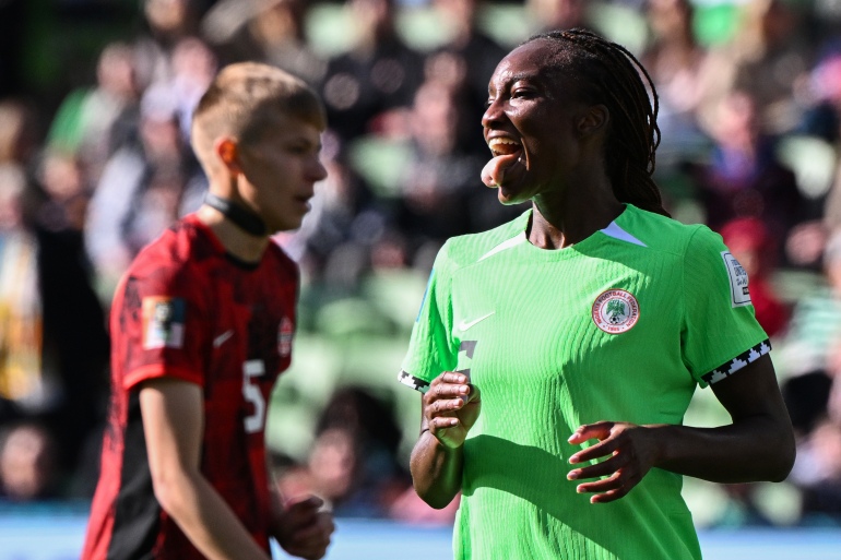Nigeria's forward #06 Ifeoma Onumonu (R) reacts after missing a chance on goal during the Australia and New Zealand 2023 Women's World Cup Group B football match between Nigeria and Canada at Melbourne Rectangular Stadium, also known as AAMI Park, in Melbourne on July 21, 2023. (Photo by WILLIAM WEST / AFP)