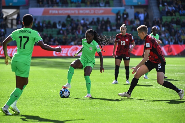 igeria's midfielder #07 Toni Payne (C) and Canada's midfielder #05 Rebecca Quinn (R) vie for the ball during the Australia and New Zealand 2023 Women's World Cup Group B football match between Nigeria and Canada at Melbourne Rectangular Stadium, also known as AAMI Park, in Melbourne on July 21, 2023. (Photo by WILLIAM WEST / AFP)