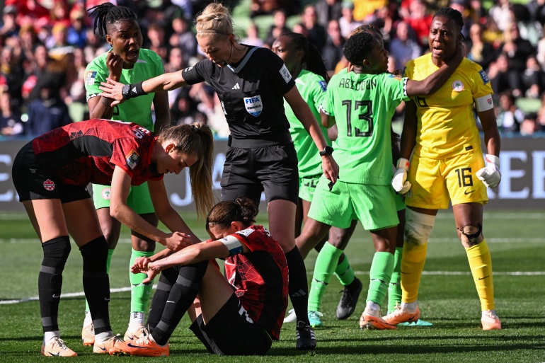 Canada's forward #12 Christine Sinclair reacts on the ground after missing a penalty during the Australia and New Zealand 2023 Women's World Cup Group B football match between Nigeria and Canada at Melbourne Rectangular Stadium, also known as AAMI Park, in Melbourne on July 21, 2023. (Photo by WILLIAM WEST / AFP)