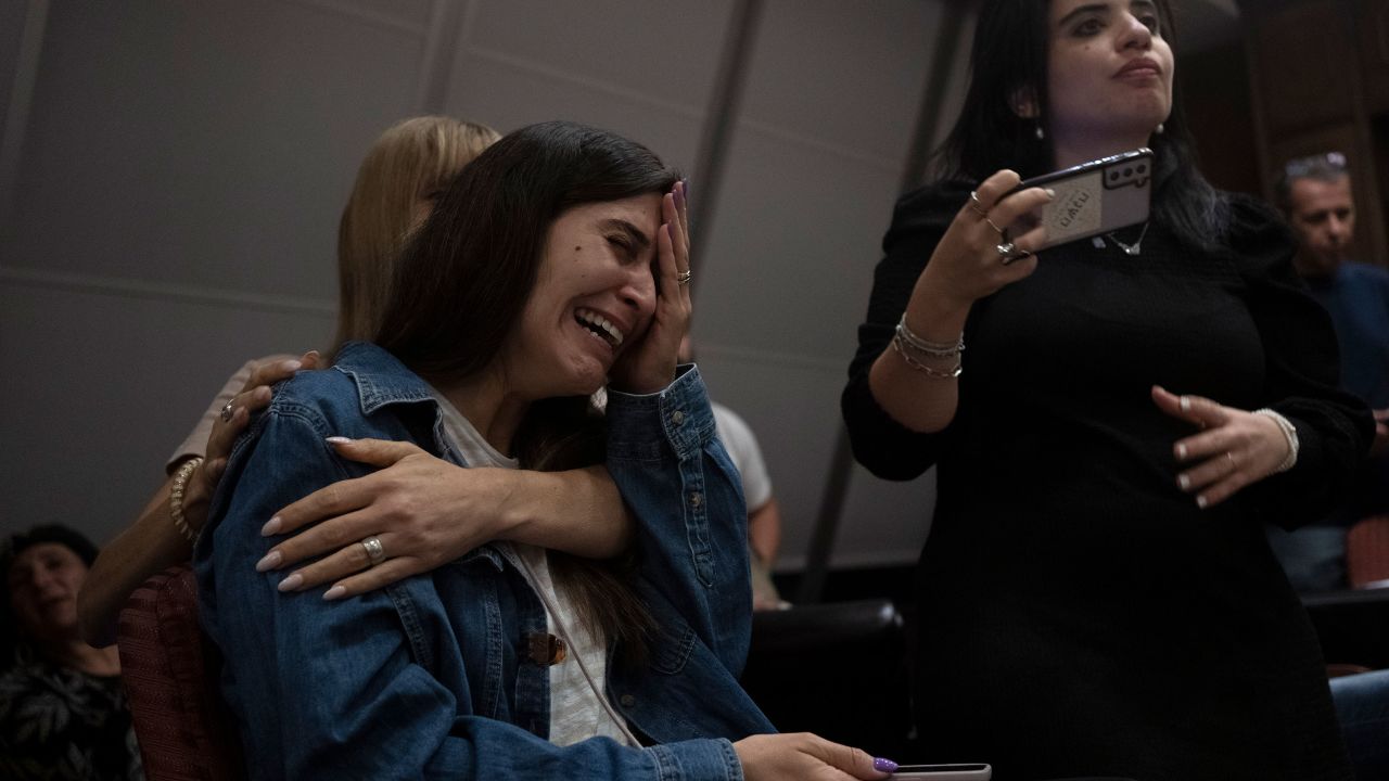 A relative of an Israeli missing since the attack by Hamas cries during a press conference in Ramat Gan, Israel on Sunday.