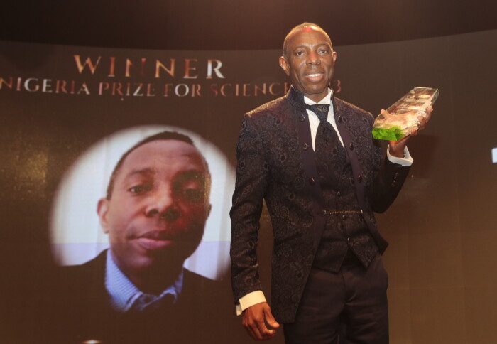 Professor Amadi onstage with his award