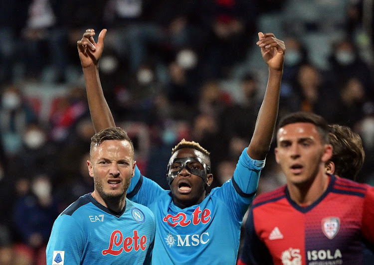 Napoli's Victor Osimhen (C) and Amir Rrahmani during their match against Cagliari