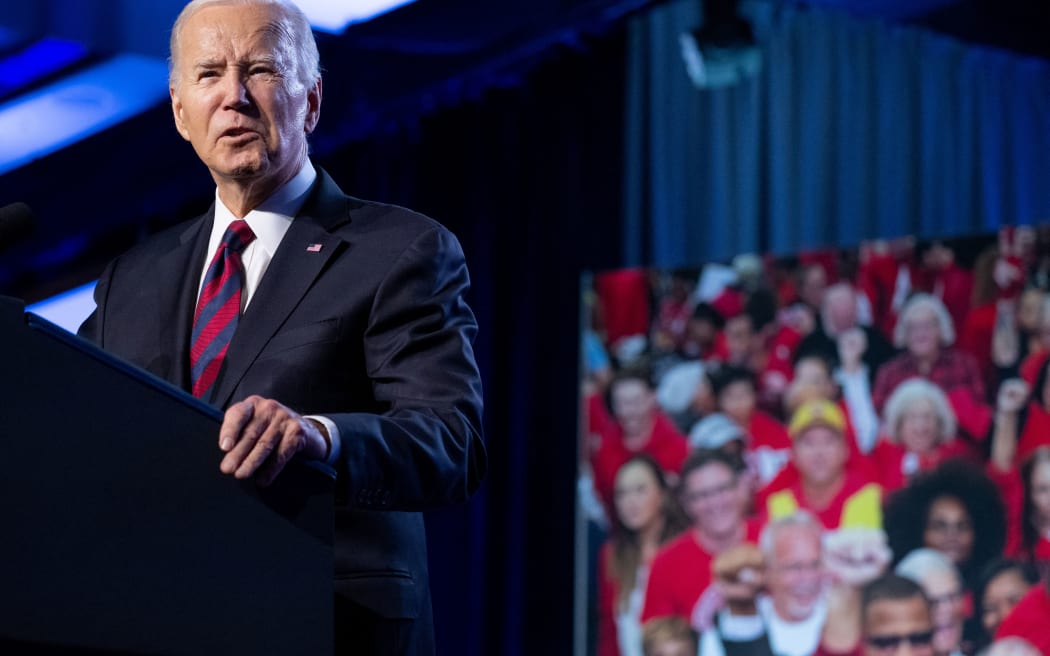US President Joe Biden speaks during the United Auto Workers union conference at the Marriott Marquis in Washington, DC, on January 24, 2024. US President Joe Biden won the coveted election endorsement of America's biggest car workers union Wednesday, in a major boost to the Democrat's battle with Donald Trump for the crucial blue-collar vote. (Photo by SAUL LOEB / AFP)