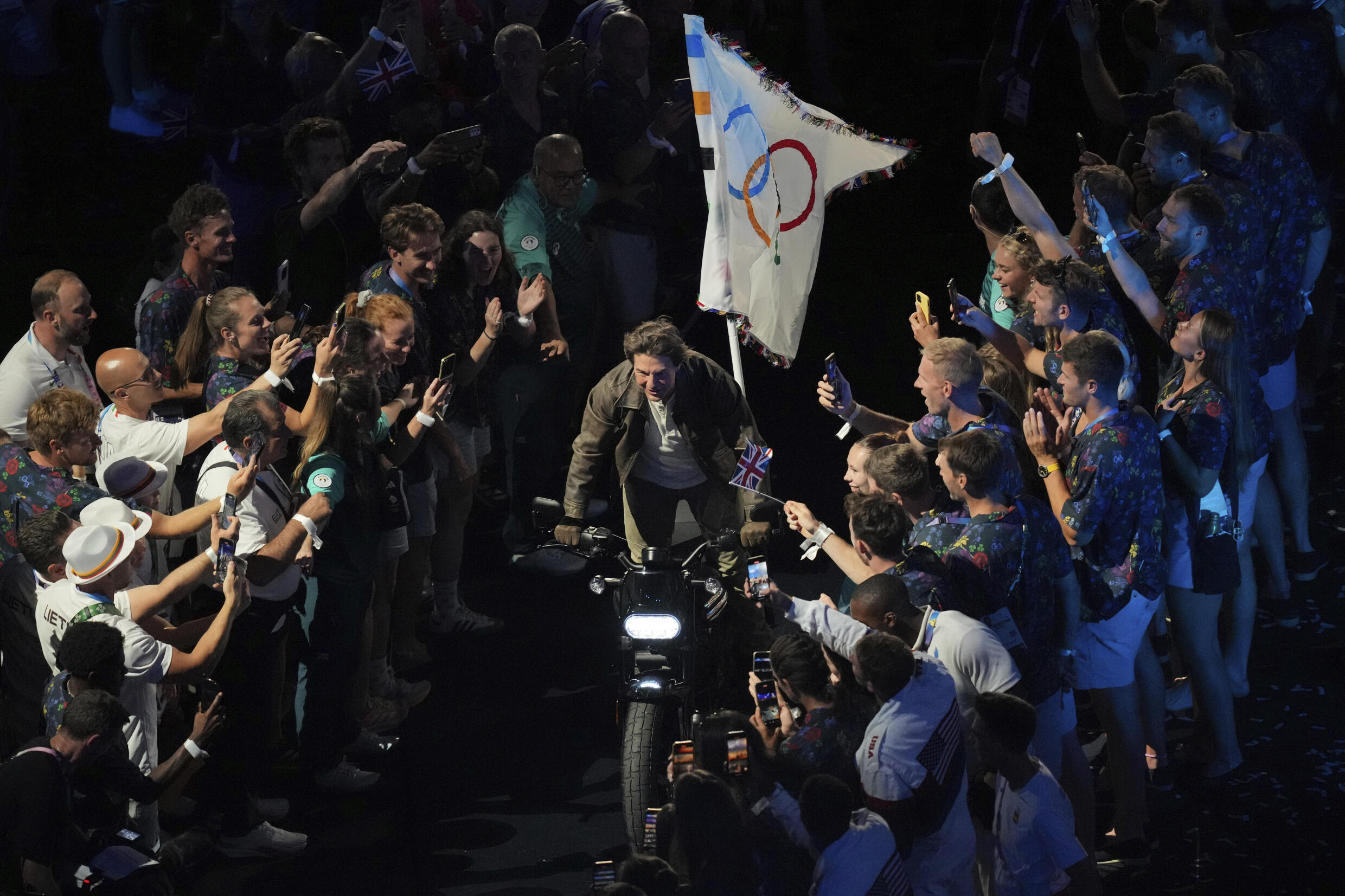 Tom Cruise rides a motorbike during the 2024 Summer Olympics closing ceremony at the Stade de France, Sunday, Aug. 11, 2024, in Saint-Denis, France.