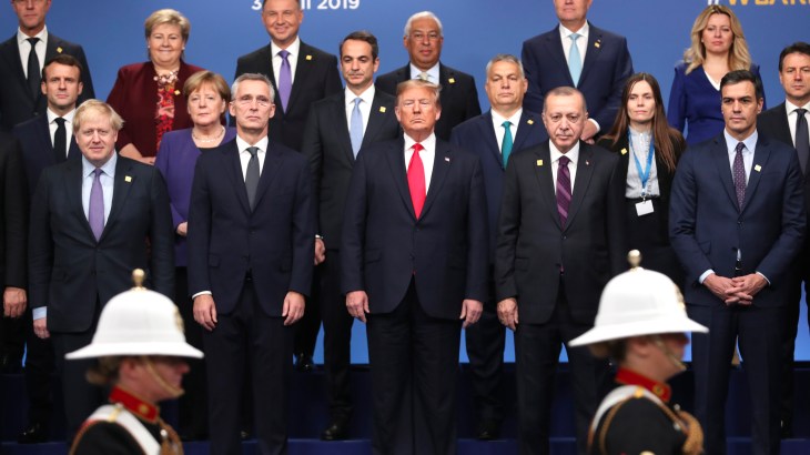 From front row left, British Prime Minister Boris Johnson, NATO Secretary-General Jens Stoltenberg, US President Donald Trump, Turkish President Recep Tayyip Erdogan and Spanish Prime Minister Pedro Sanchez attend a ceremony event