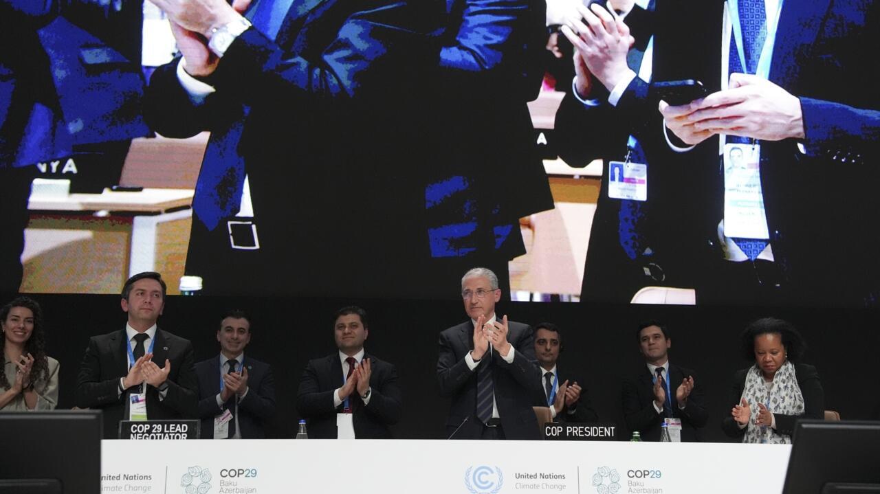 Mukhtar Babayev, COP29 President, centre, applauds during a closing plenary session at the COP29 UN Climate Summit, Sunday, Nov. 24, 2024, in Baku, Azerbaijan.