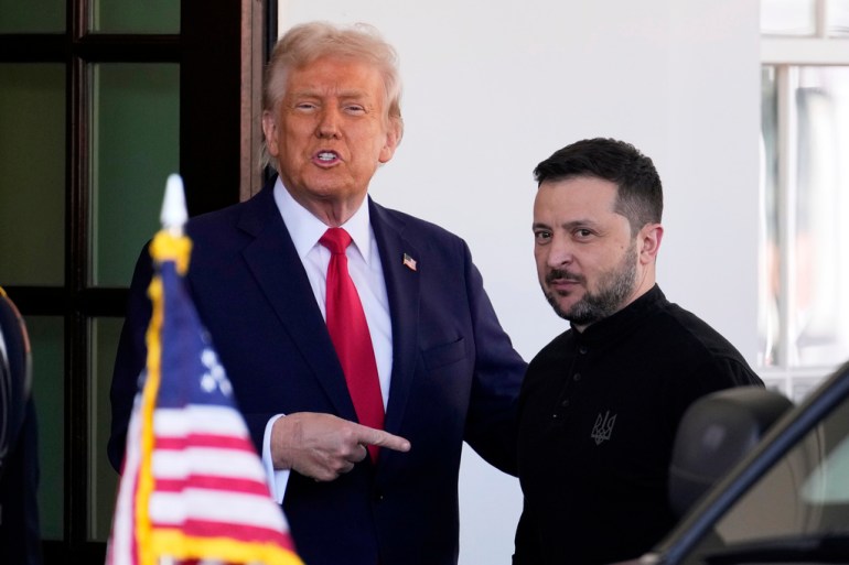 Donald Trump points at Zelenskyy in the White House valet circle
