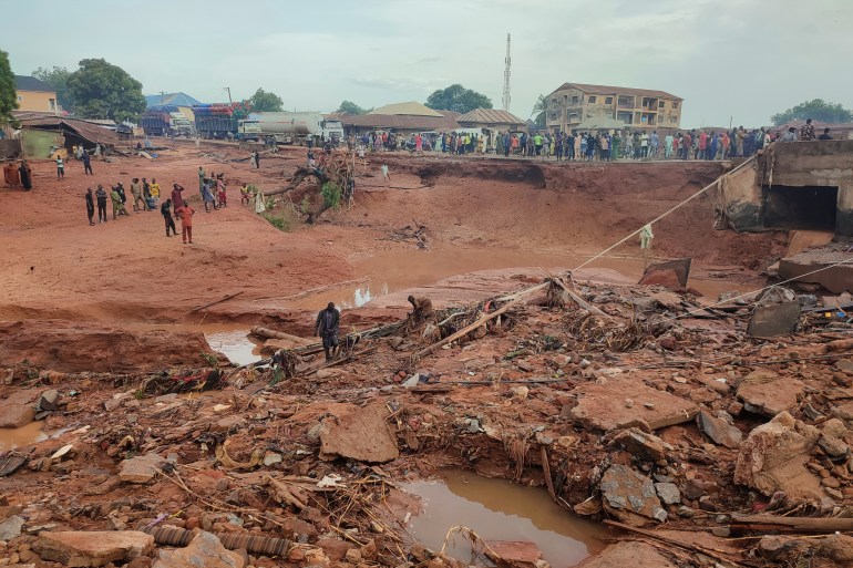 People search in flooded area following a downpour in Mokwa, Nigeria