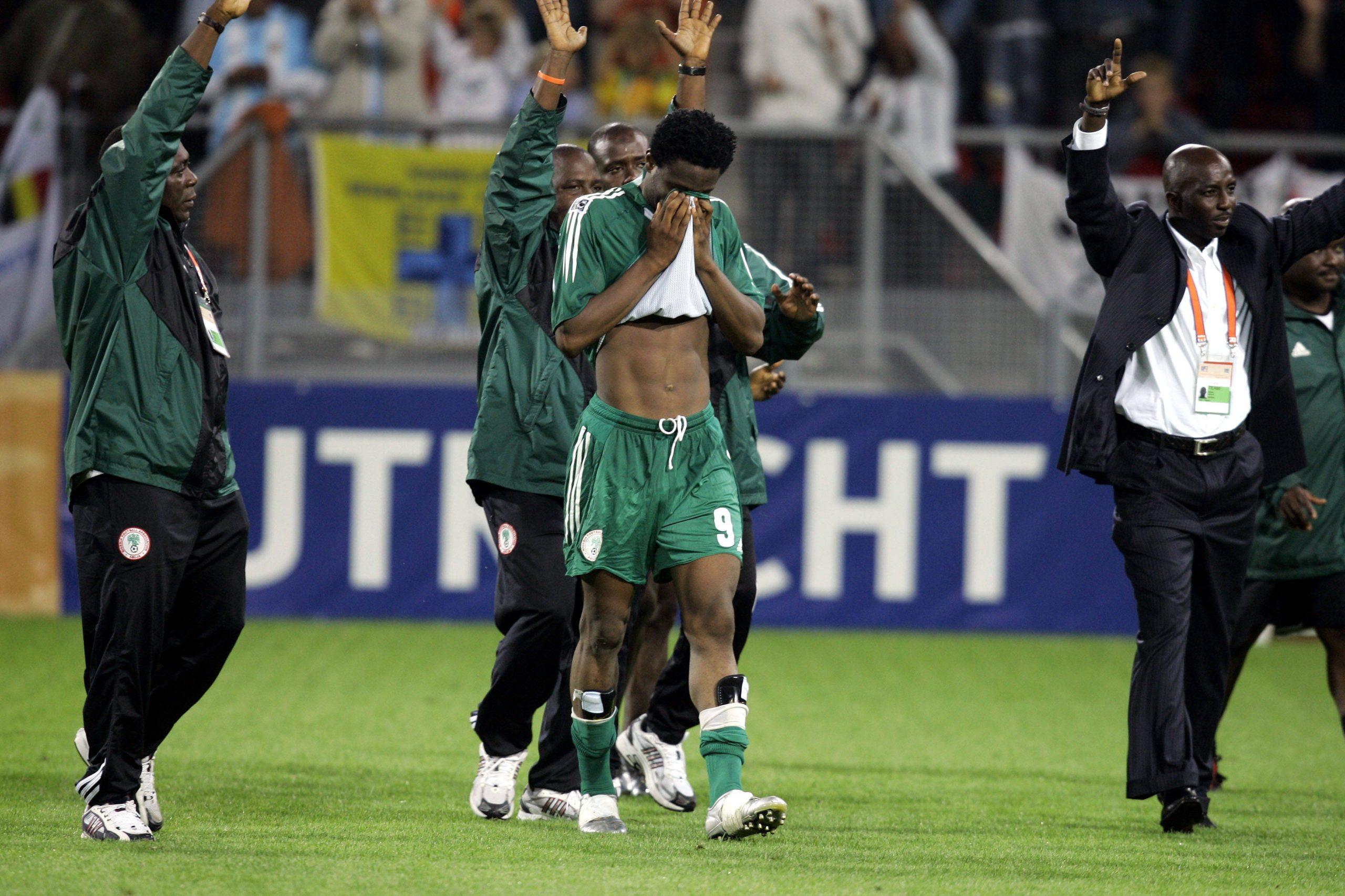 Nigeria and chelsea player John Obi Mikel disappointed after lost final. Right Nigeria s coach Samson Siasia