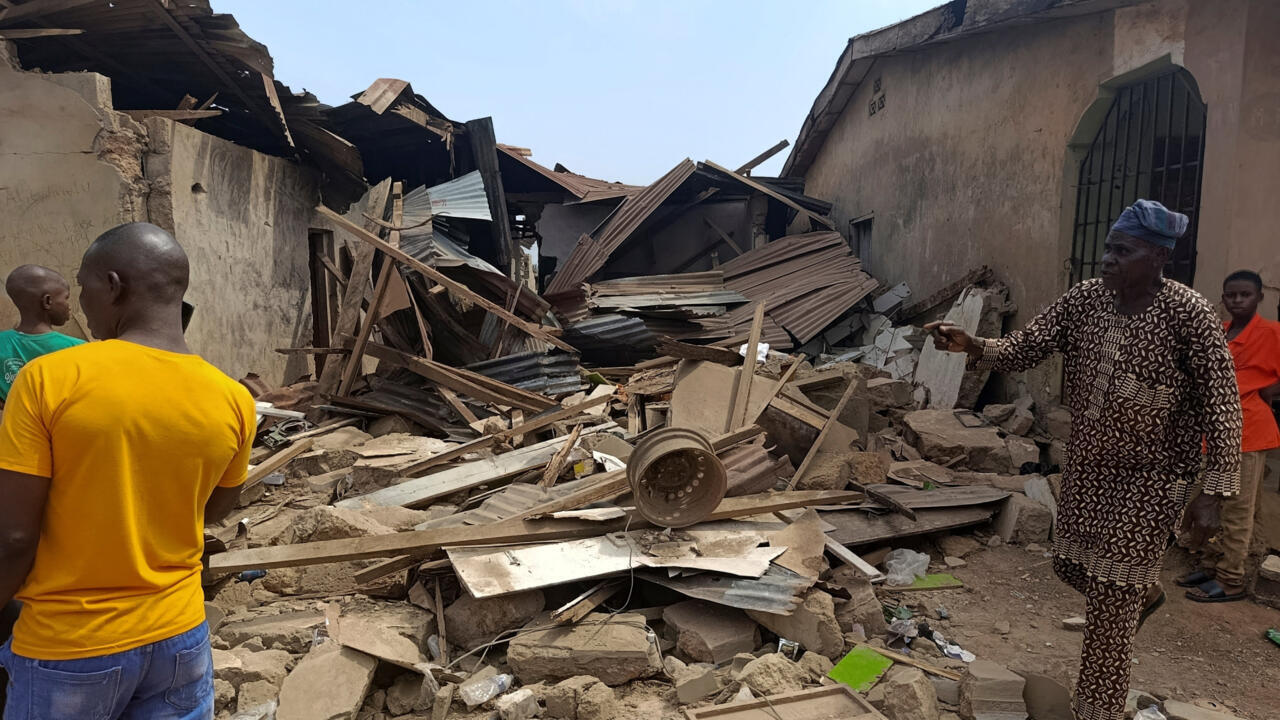 Residents inspect the damage after US forces had launched a strike against Islamic State group militants in Nigeria at the request of Nigeria's government