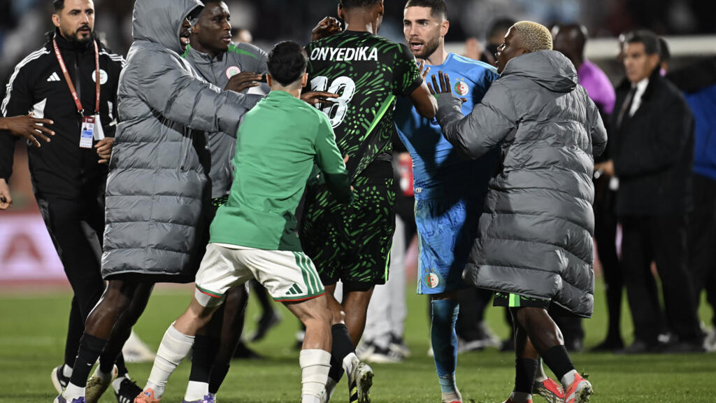 Nigeria's Raphael Onyedika and Algeria 'keeper Luca Zidane square up after Nigeria's 2-0 quarter-final win