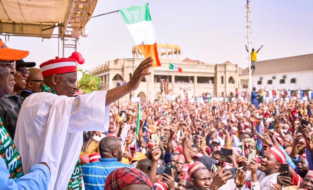 Kwankwaso waving to crowd during a defection rally in Kano recently.