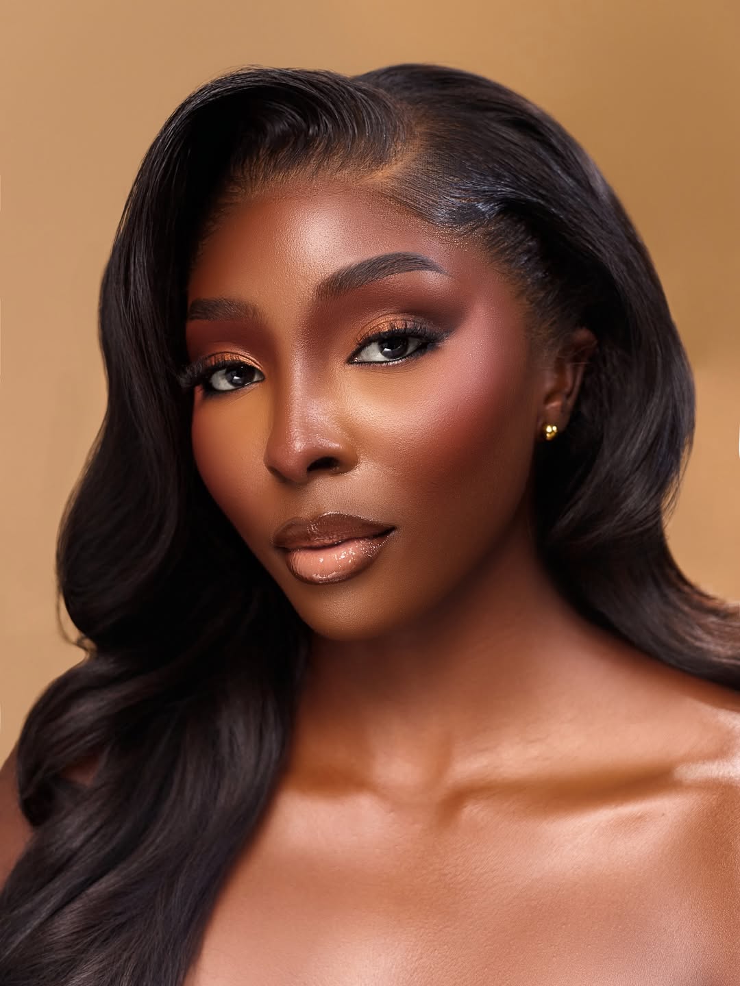 Close-up beauty headshot of Tamunosoye Karibi George with soft wavy hair and classic pageant makeup.