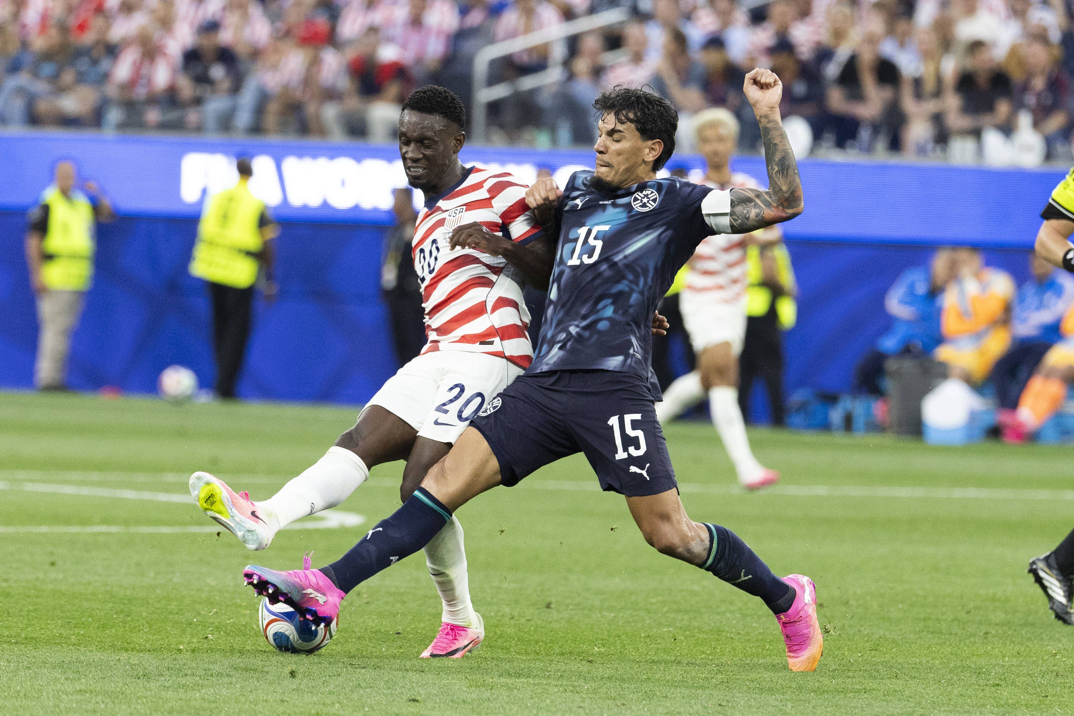 Folarin Balogun and Gustavo Gomez vie for the ball during the FIFA World Cup Group D match at SoFi Stadium in Inglewood